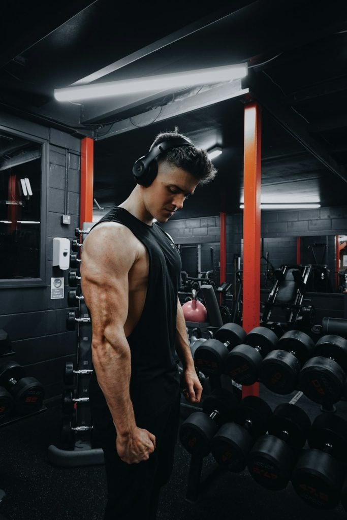 Home Man In Black Tank Top Wearing Black Headphones 9y4matz2js0 683x1024